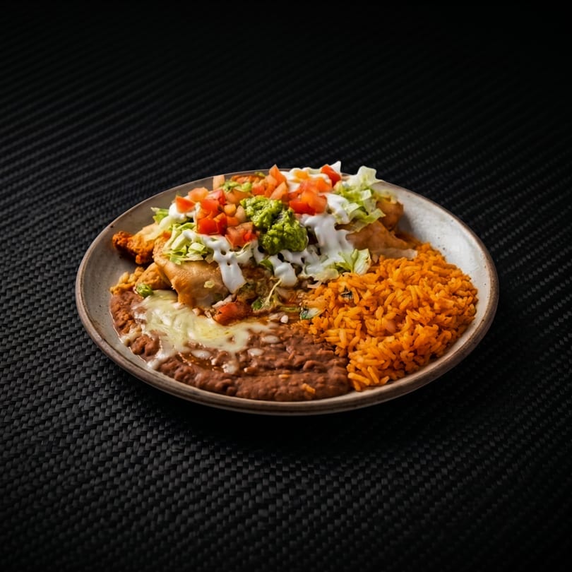 Crispy taquitos, refried beans, and orange rice topped with fresh salsa, guacamole, and sour cream.